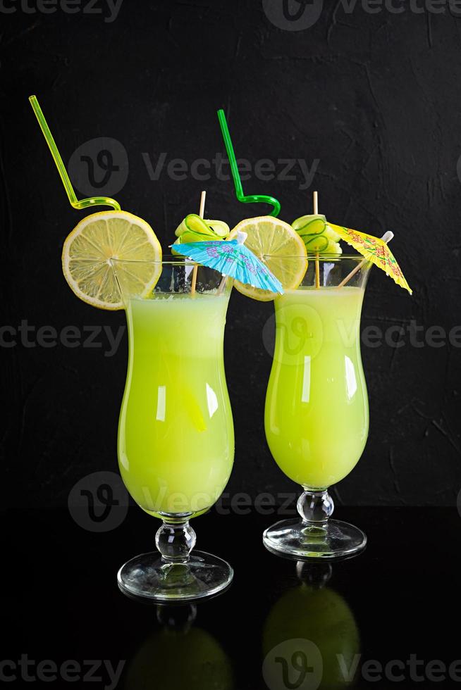 Glass of fresh cucumber juice. Cocktail with cucumber, ice and lemon