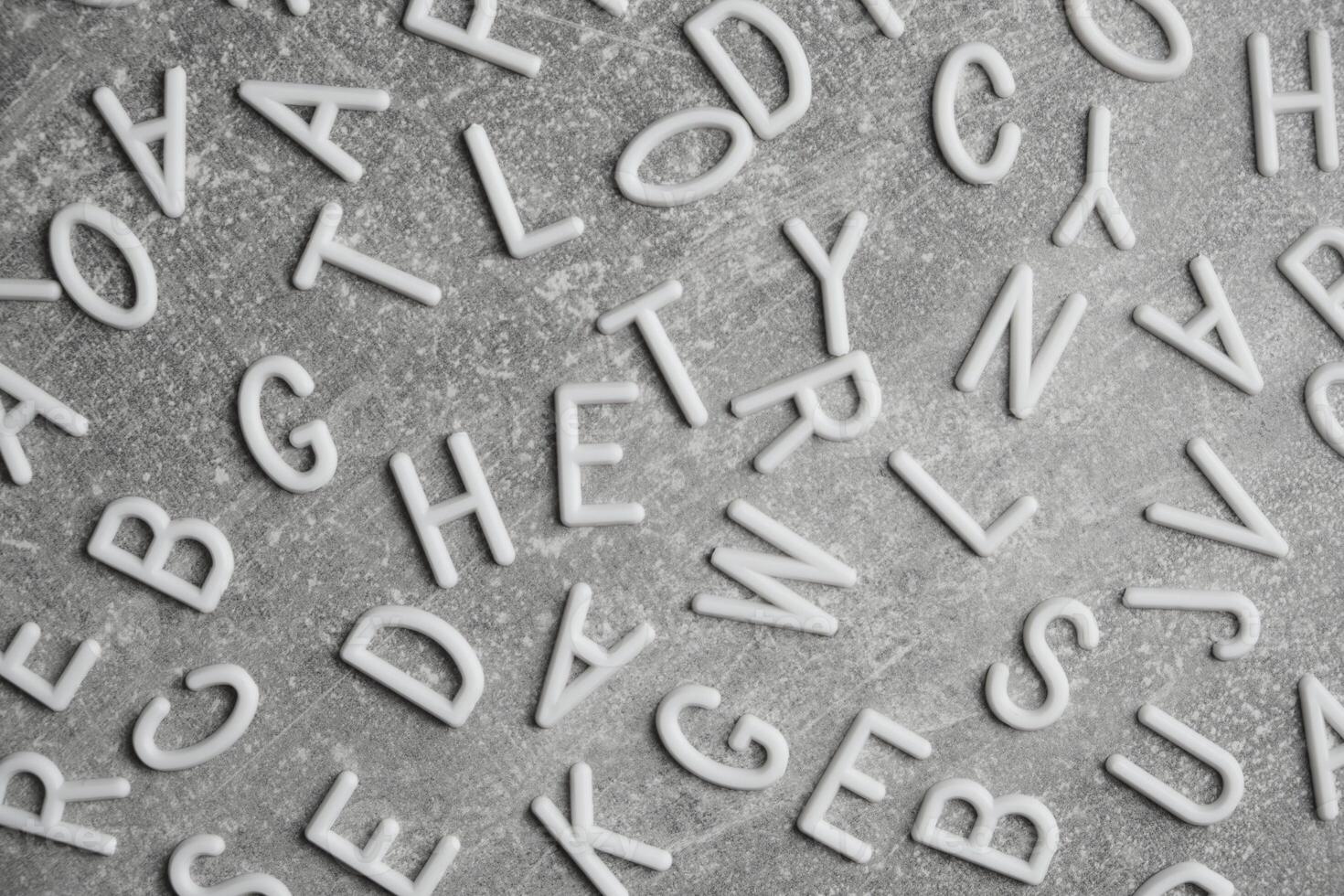 White letters English alphabet gray concrete background. 19566366 Stock Photo at Vecteezy