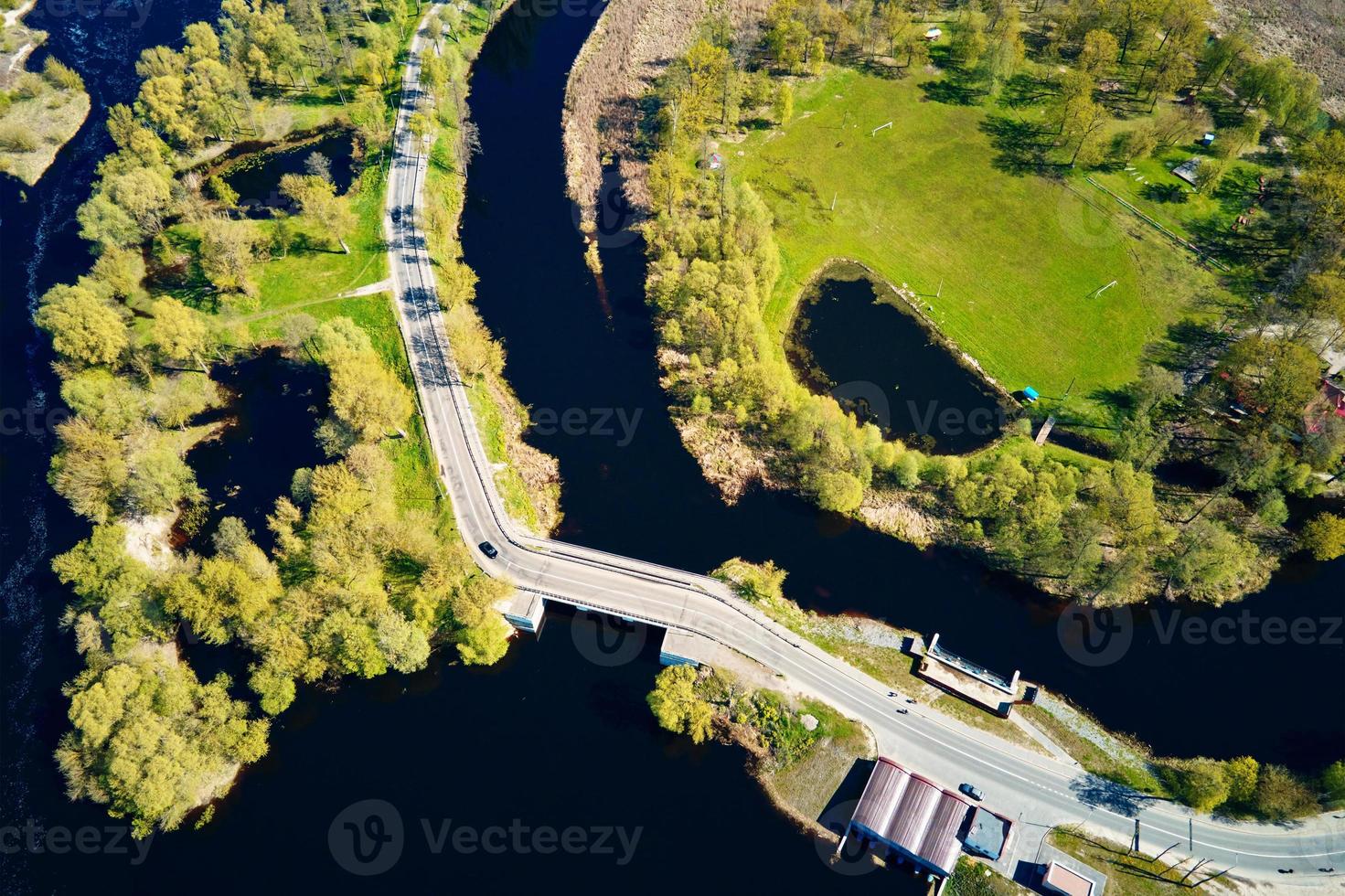 Car moving on bridge in europe small town, aerial view photo
