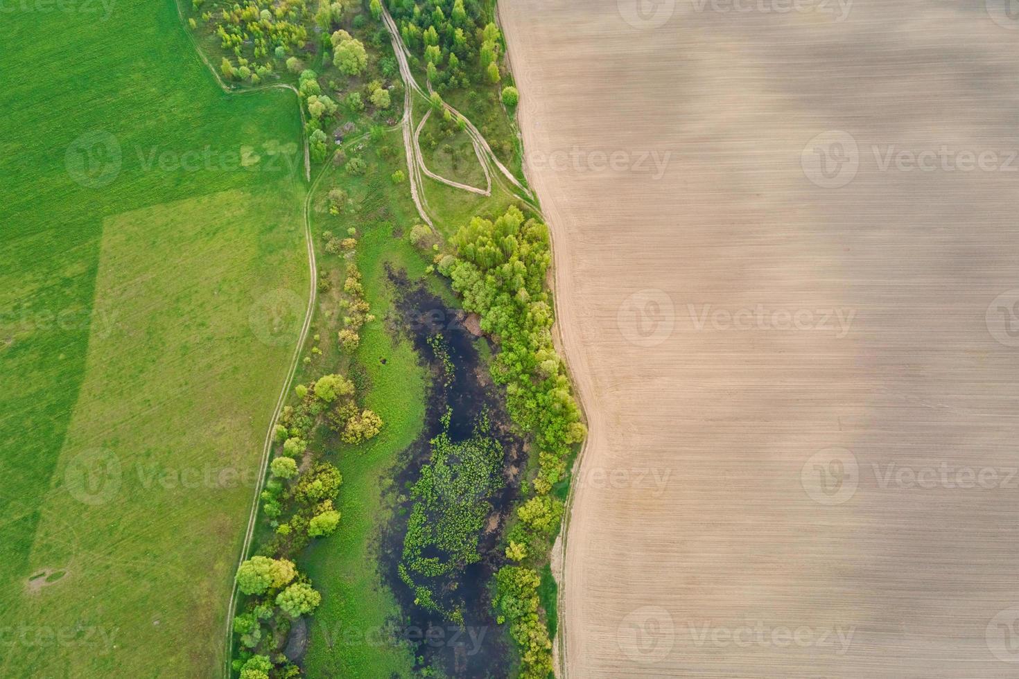 Aerial view of agricultural and green fields in countryside photo