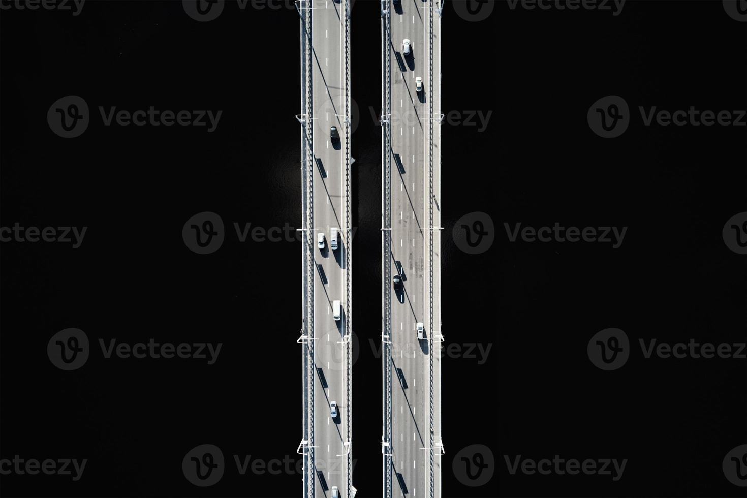 Aerial view of bridge over river with cars photo