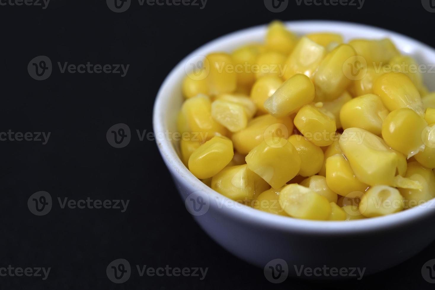 Fresh canned corn. Corn kernels in a white salad bowl. Corn in a cup