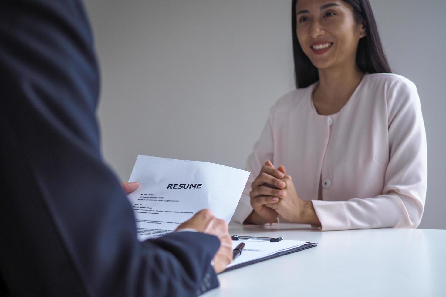 Executives are interviewing candidates. photo