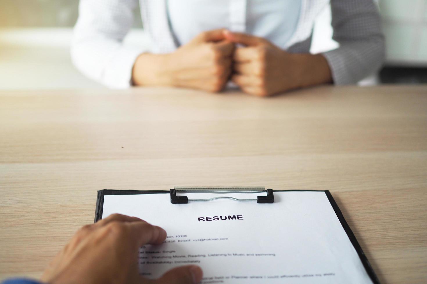 Executives are interviewing. Focus on resume writing tips, candidate qualifications, skills to answer questions, and preparation before interview. To consider the decision to accept employees. photo