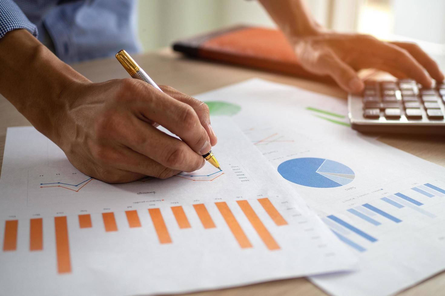 Business men looking at charts, spreadsheets, graph financial development, bank accounts, statistics, economy, data analysis, investment analysis, stock exchange photo