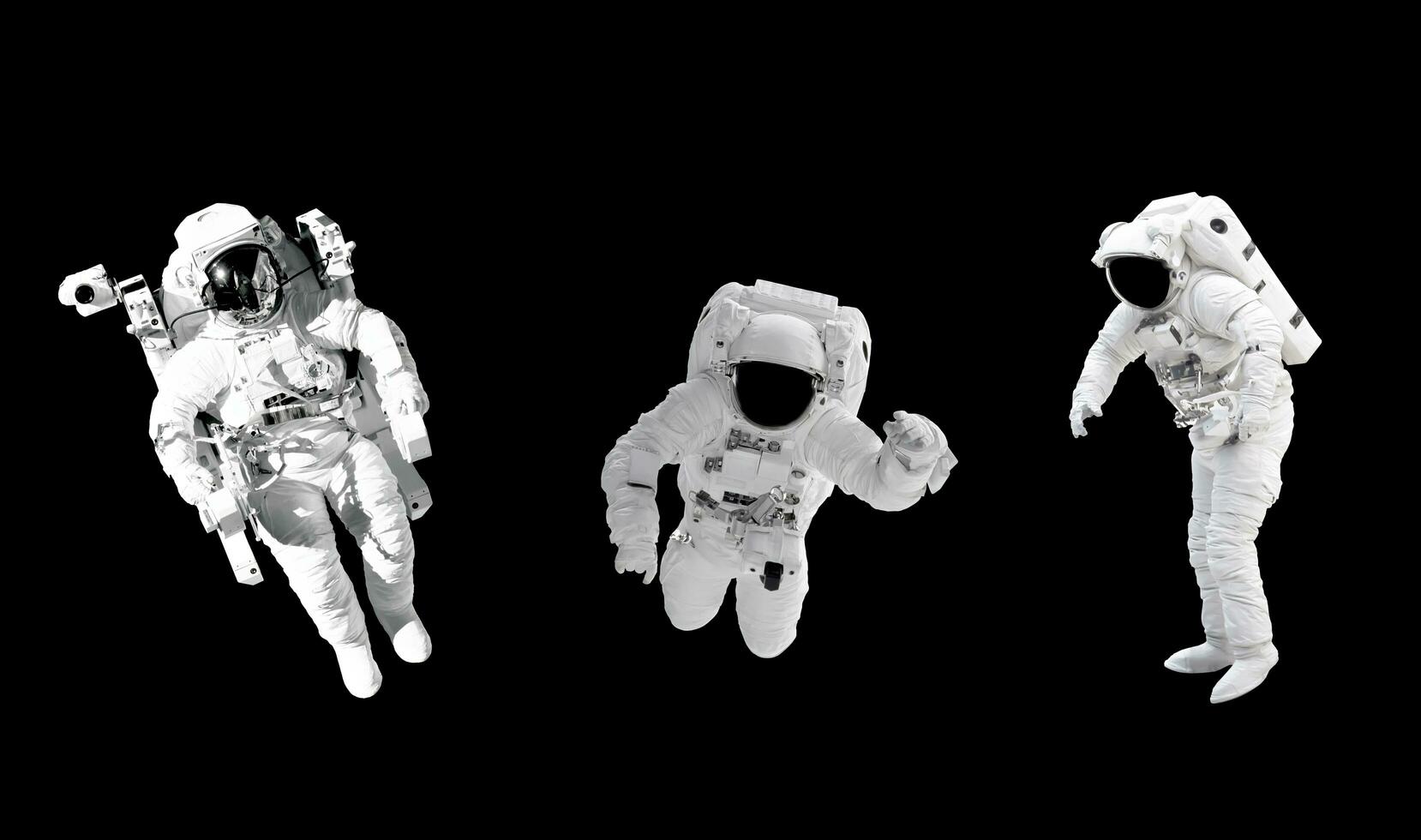 Space suits isolated on black background with clipping path. Elements of this image furnished by NASA. photo