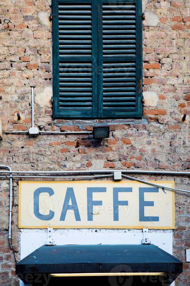 Old vintage coffee sign in Italy - Concept of retro, traditional design. photo