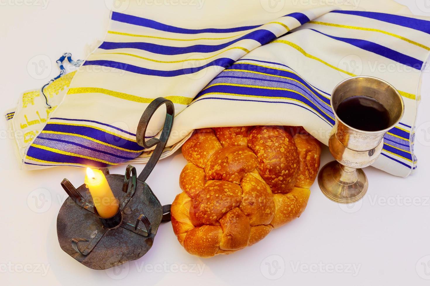 Shabbat candles in glass candlesticks isolated on black. photo