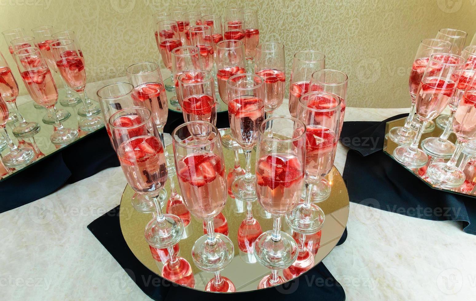 Strawberry splashing into a glass of champagne photo