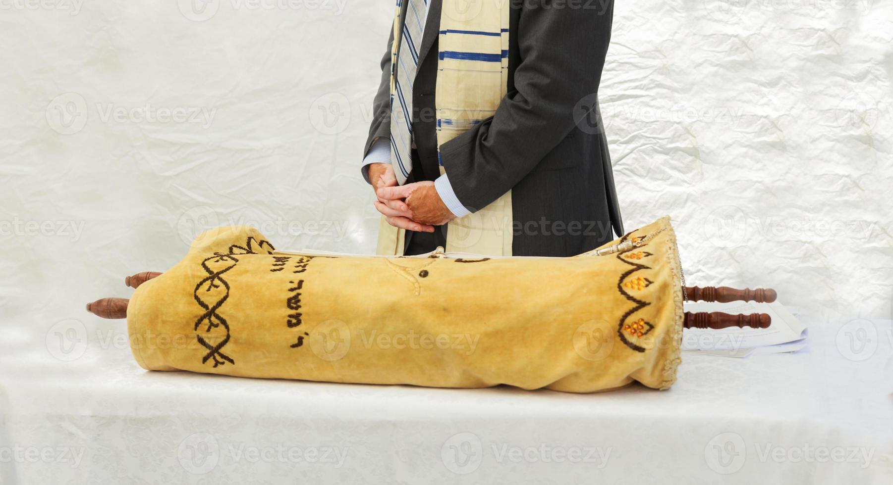 Hand of boy reading the Jewish Torah at Bar Mitzvah 5 SEPTEMBER 2016 USA photo