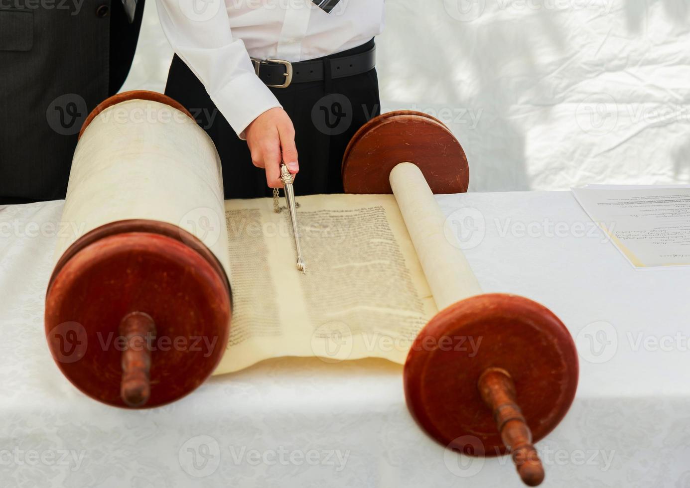 Hand of boy reading the Jewish Torah at Bar Mitzvah 5 SEPTEMBER 2016 USA photo