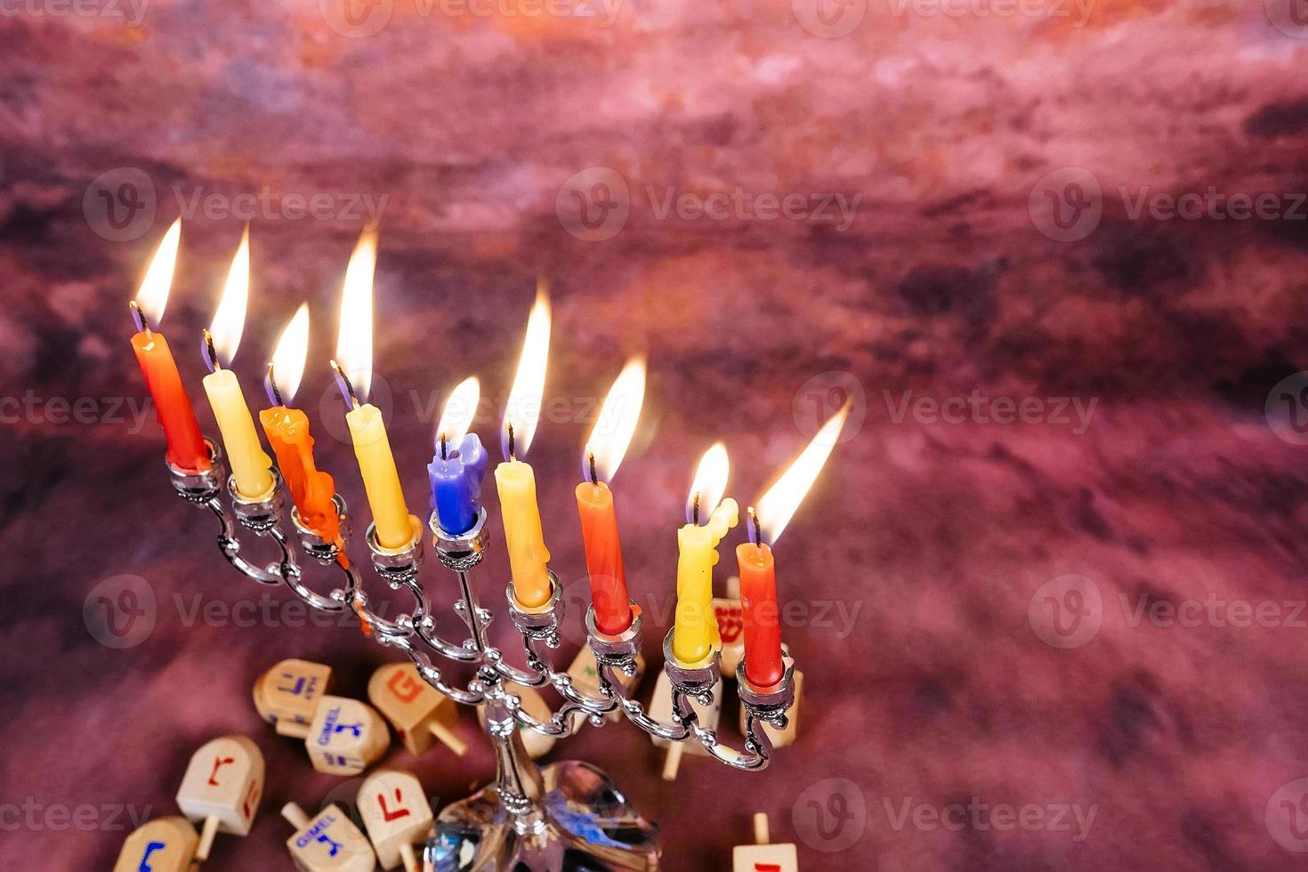Jewish holiday Hanukkah creative background with menorah. View from above focus on . photo