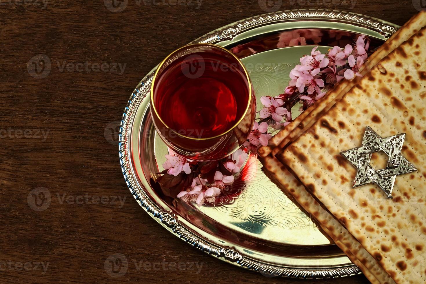 Pesach Still-life with wine and matzoh jewish passover bread photo