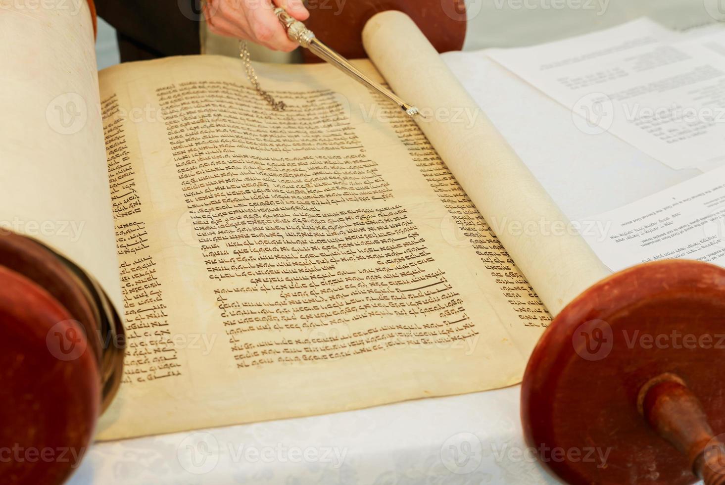 Hand of boy reading the Jewish Torah at Bar Mitzvah 5 SEPTEMBER 2016 USA photo