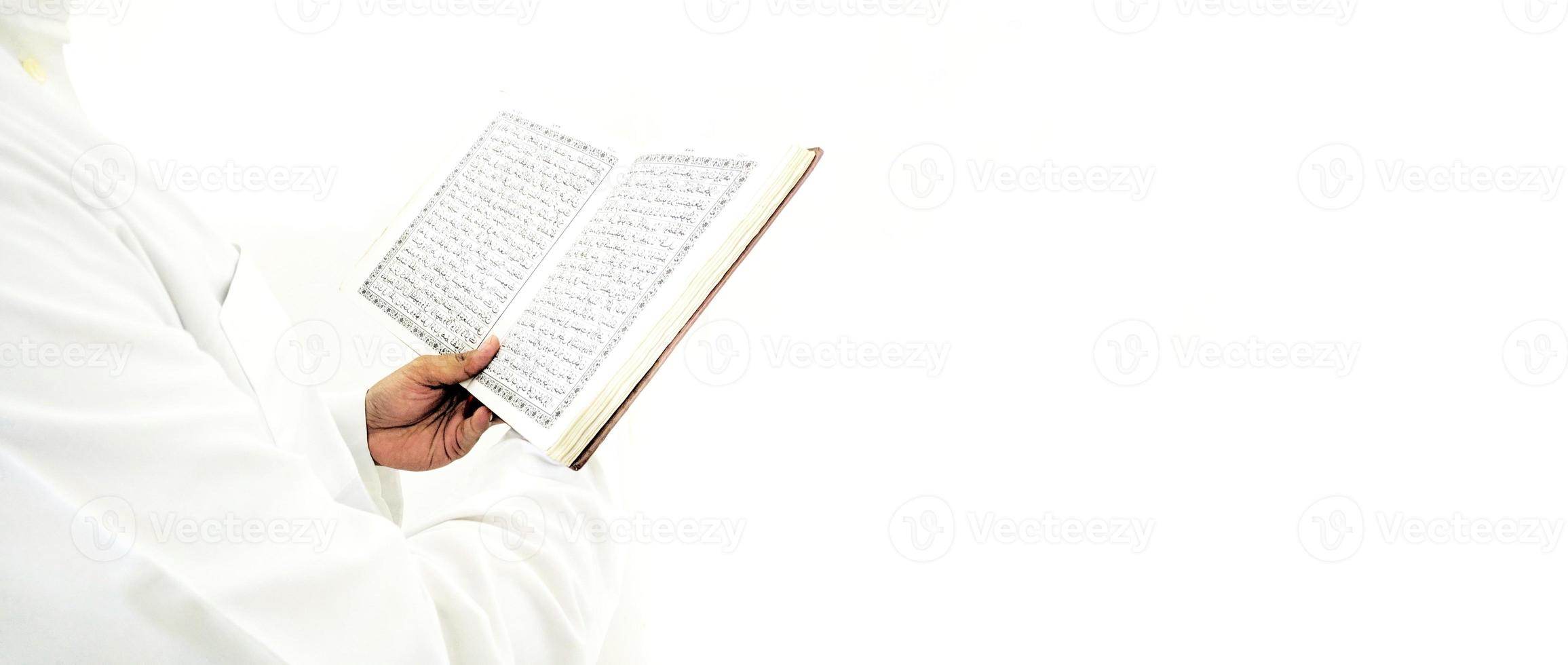 Man Holding and reading quran. Islamic Background photo