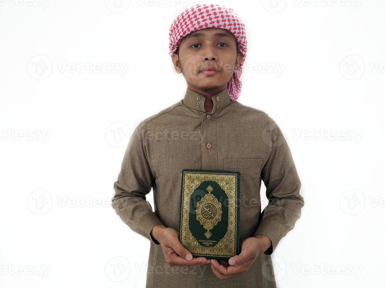 Man Holding and reading quran. Islamic Background photo