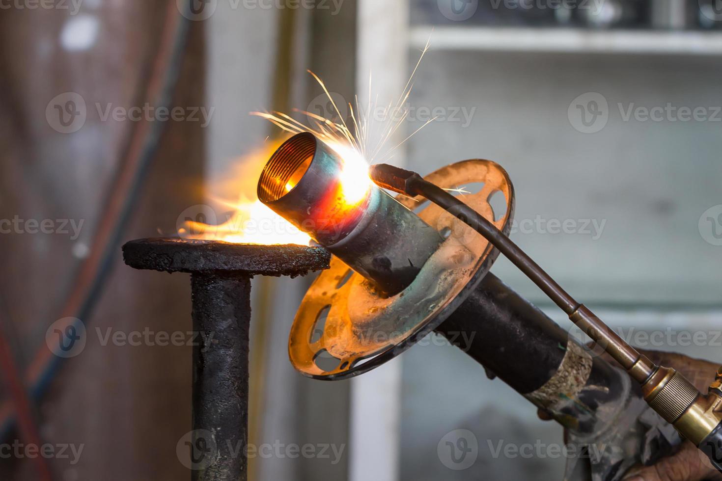 Welders were repairing Shock absorbers photo