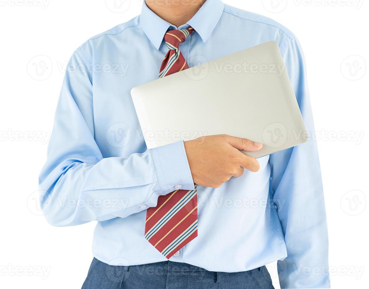 Businessman holding a laptop with clipping path photo