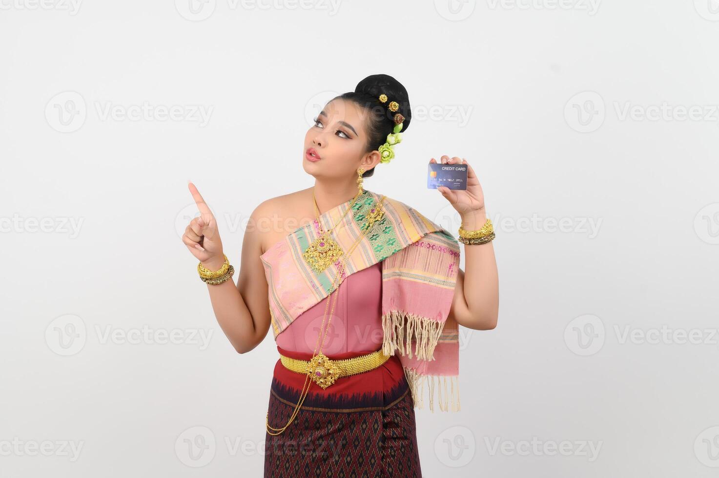 Portrait of Beautiful Thai Woman in Traditional Clothing Posing with credit card photo