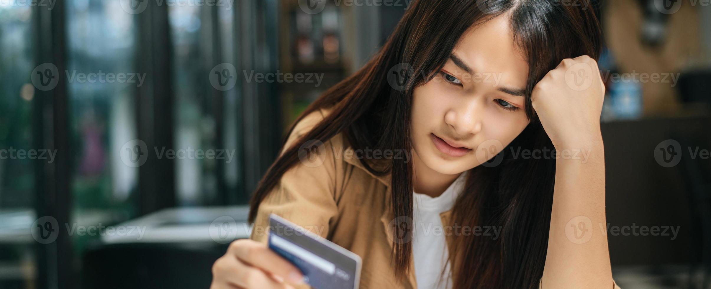 Young businesswoman paying order having contactless payment with cardit card photo