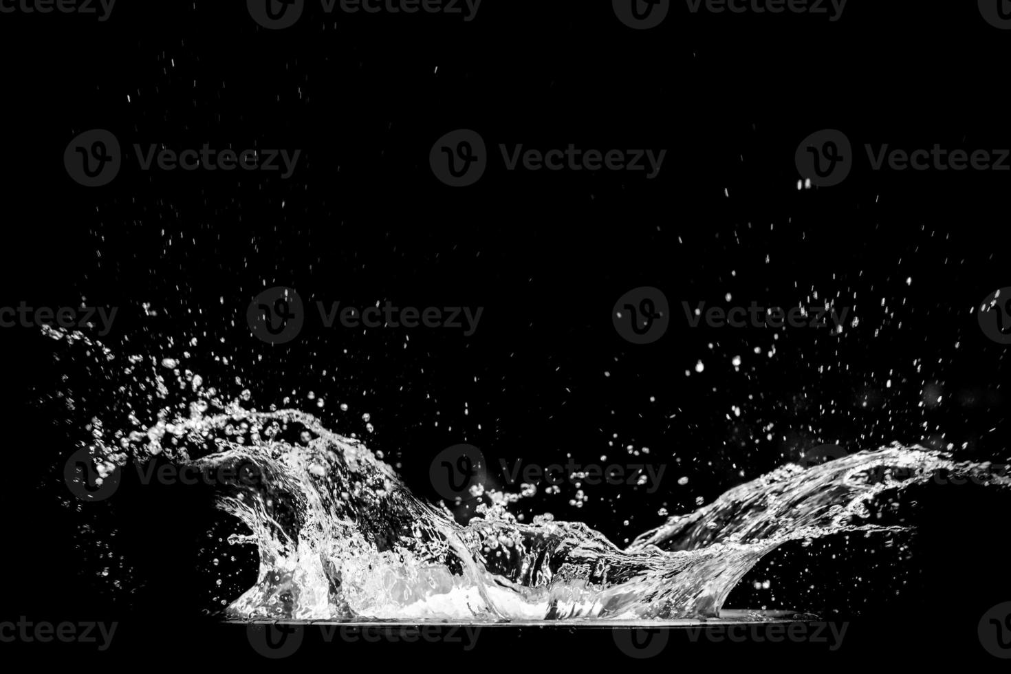 Splashing water on a black background. water splash refreshing black background photo