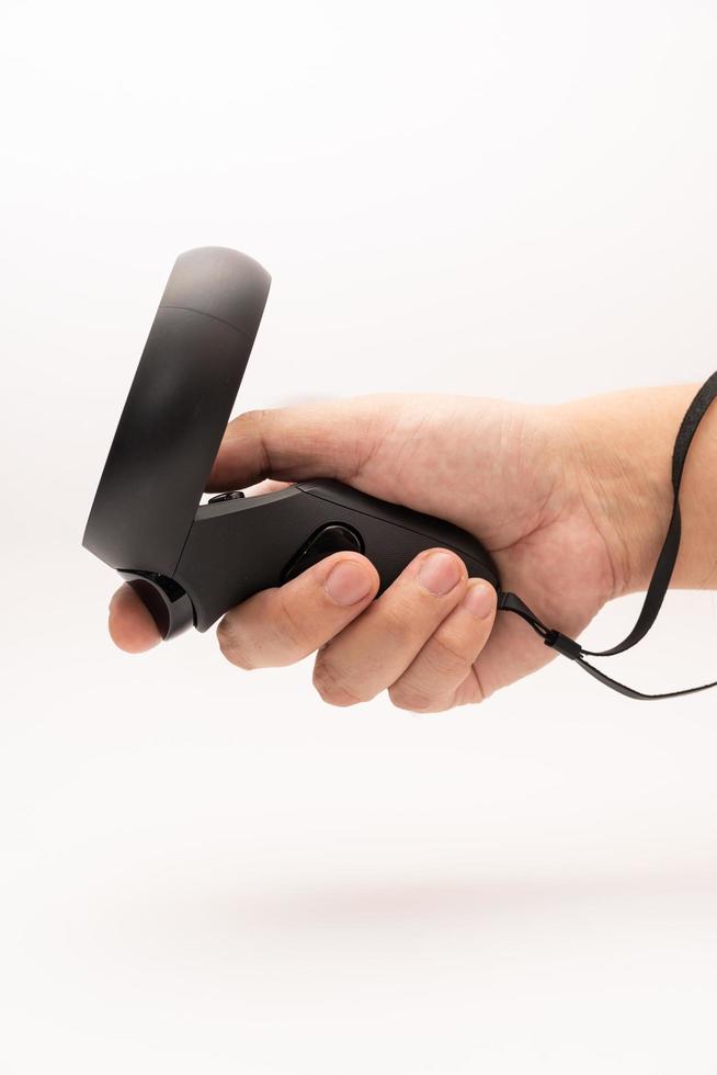 Samutprakarn Thailand Jan 23 2023 oculus rift touch controller on hand isolated on white background. Oculus Quest 2 virtual reality headset controllers. photo