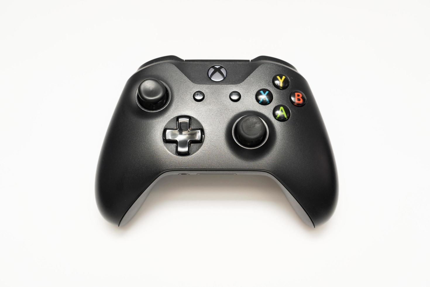 Samutprakarn Thailand Jan 23 2023 Wireless gamepad for the Xbox One on desk with keyboard. Black Xbox game controller. photo