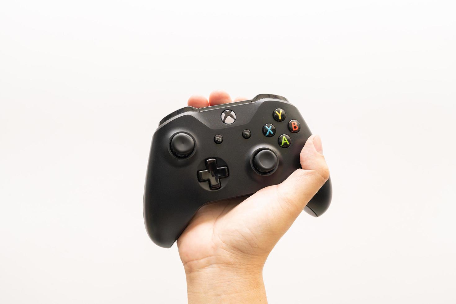 Samutprakarn Thailand Jan 23 2023 Wireless gamepad for the Xbox One on desk with keyboard. Black Xbox game controller. photo