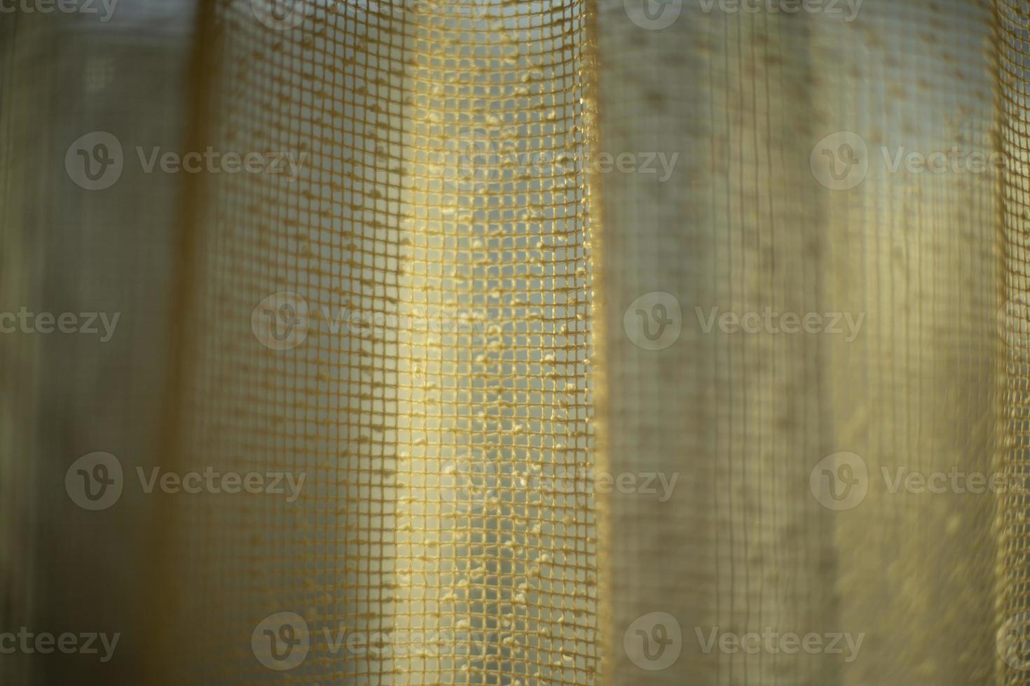 Curtains on window. Light through curtains. Fabric texture. structure of fine grid. photo