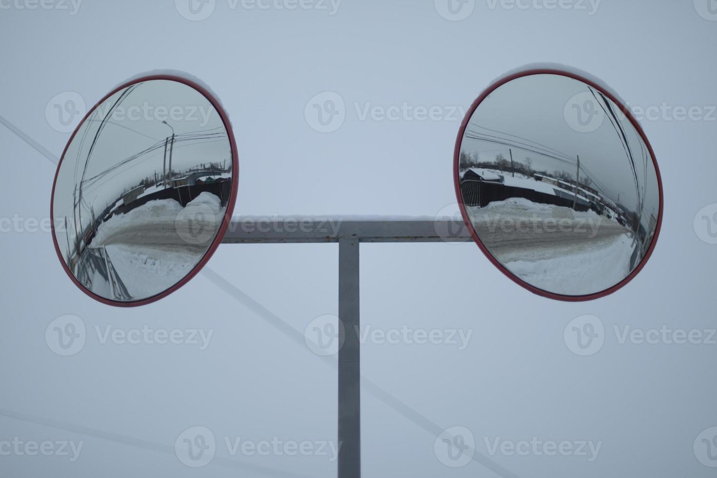 Spherical mirror for safety. Spherical mirror on road. photo