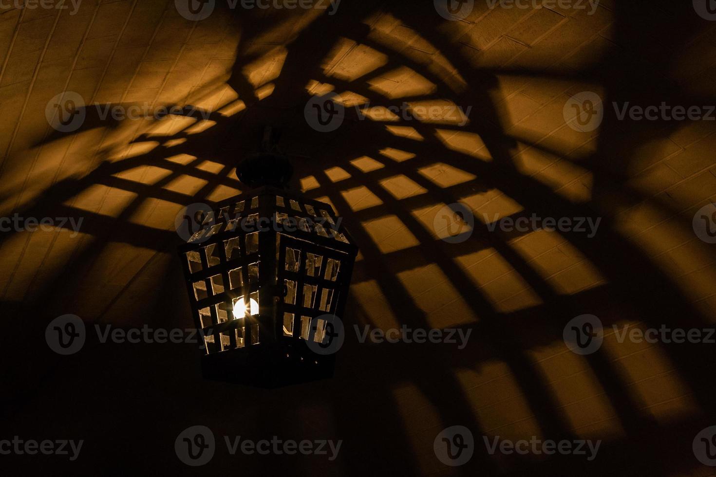 Antique lamps chandeliers in the cave dungeon photo