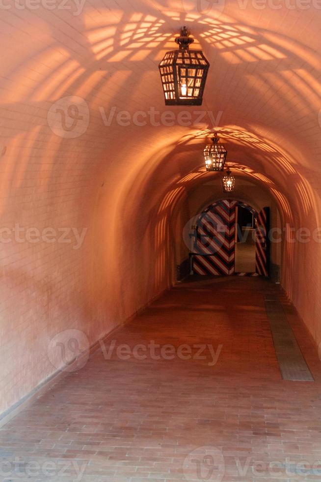 Antique lamps chandeliers in the cave dungeon photo