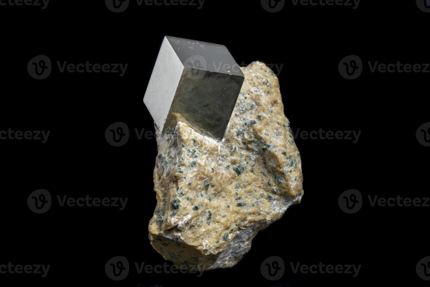 Macro Pyrite mineral stone on black background photo