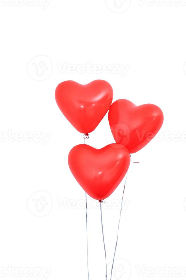 Red heart shaped helium balloon isolated on white background with ropes, Valentine's day, Mother's day, birthday party design concept. Clipping path. photo