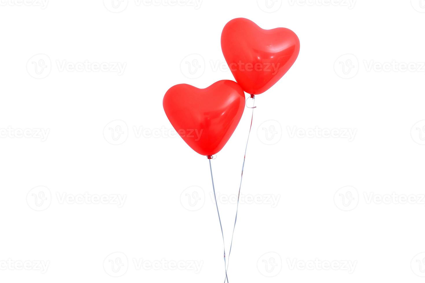 Red heart shaped helium balloon isolated on white background with ropes, Valentine's day, Mother's day, birthday party design concept. Clipping path. photo