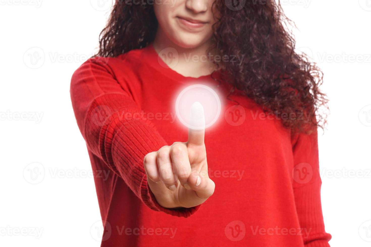 girl pushing virtual button on touch screen photo