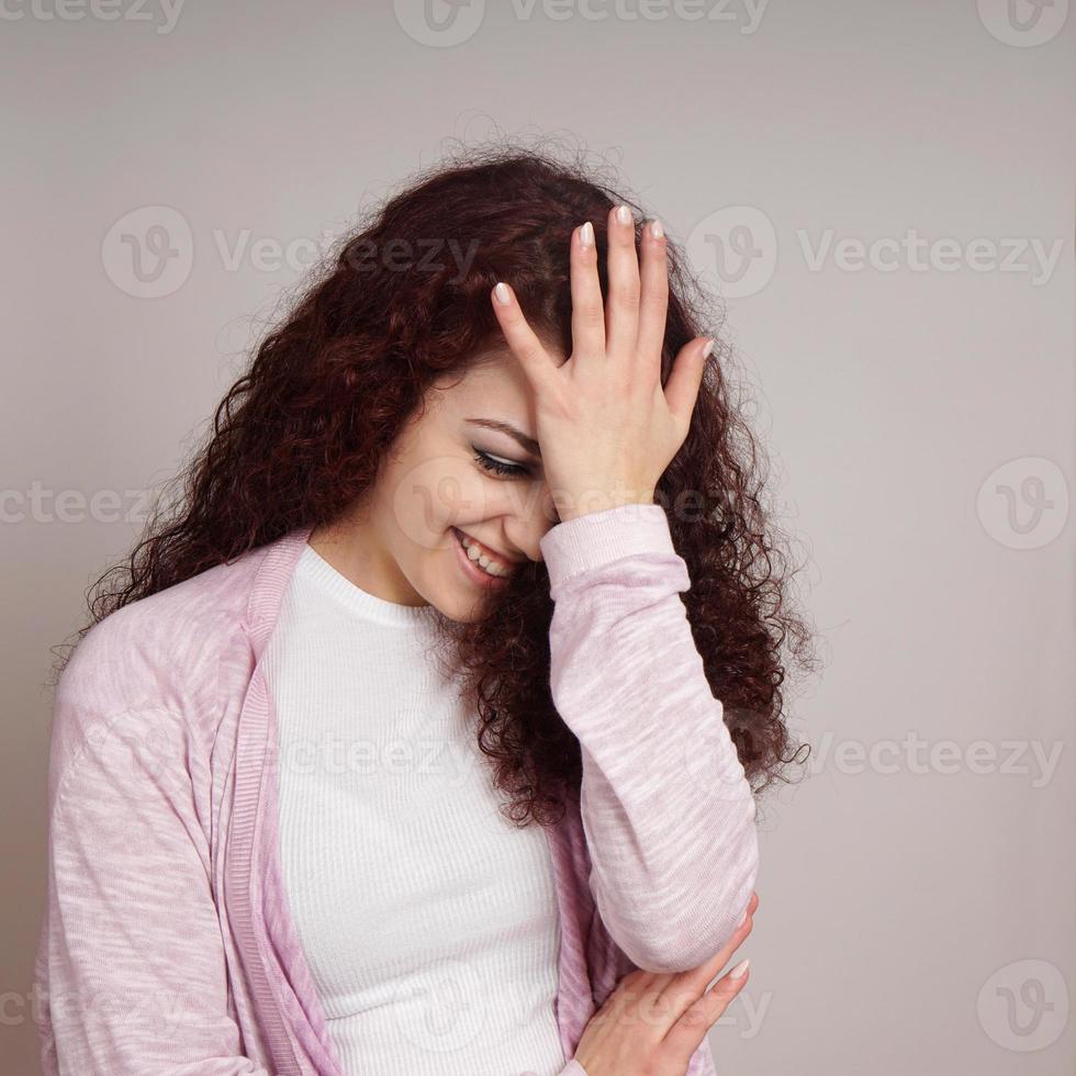 embarrassed young woman facepalm photo