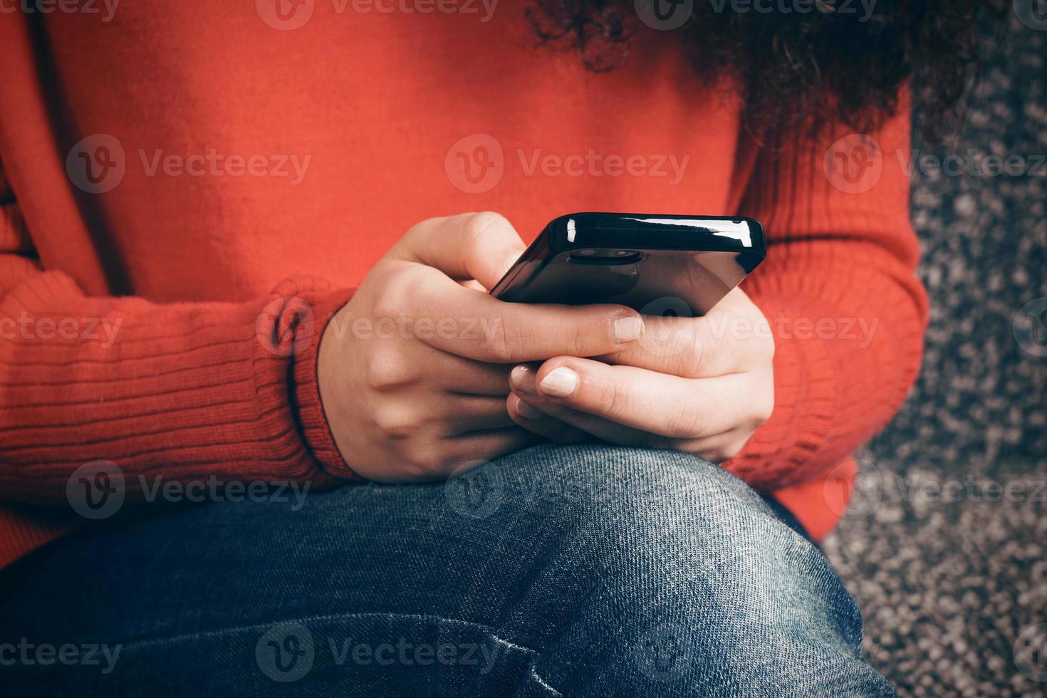 close-up of female hands using smartphone photo