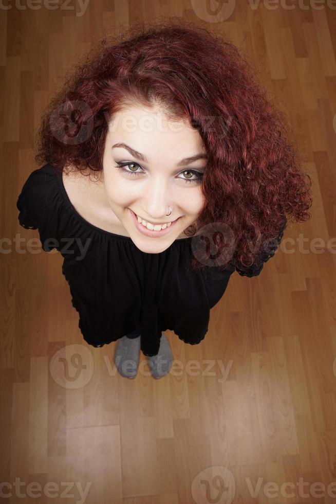 wide high angle view of beautiful young woman looking up photo