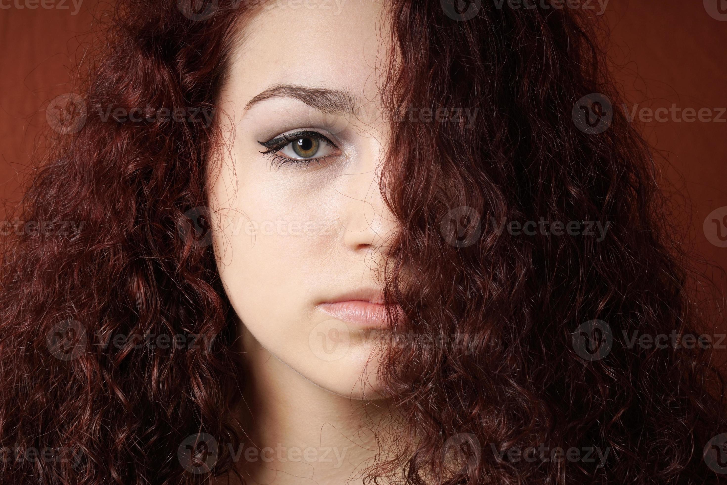 sullen girl with natural curly hair 19577275 Stock Photo at Vecteezy