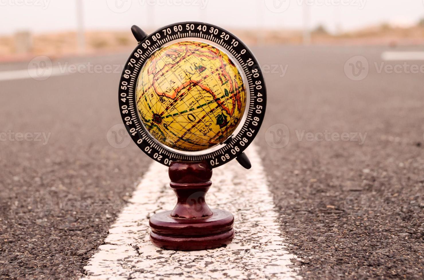 Globe on the road photo