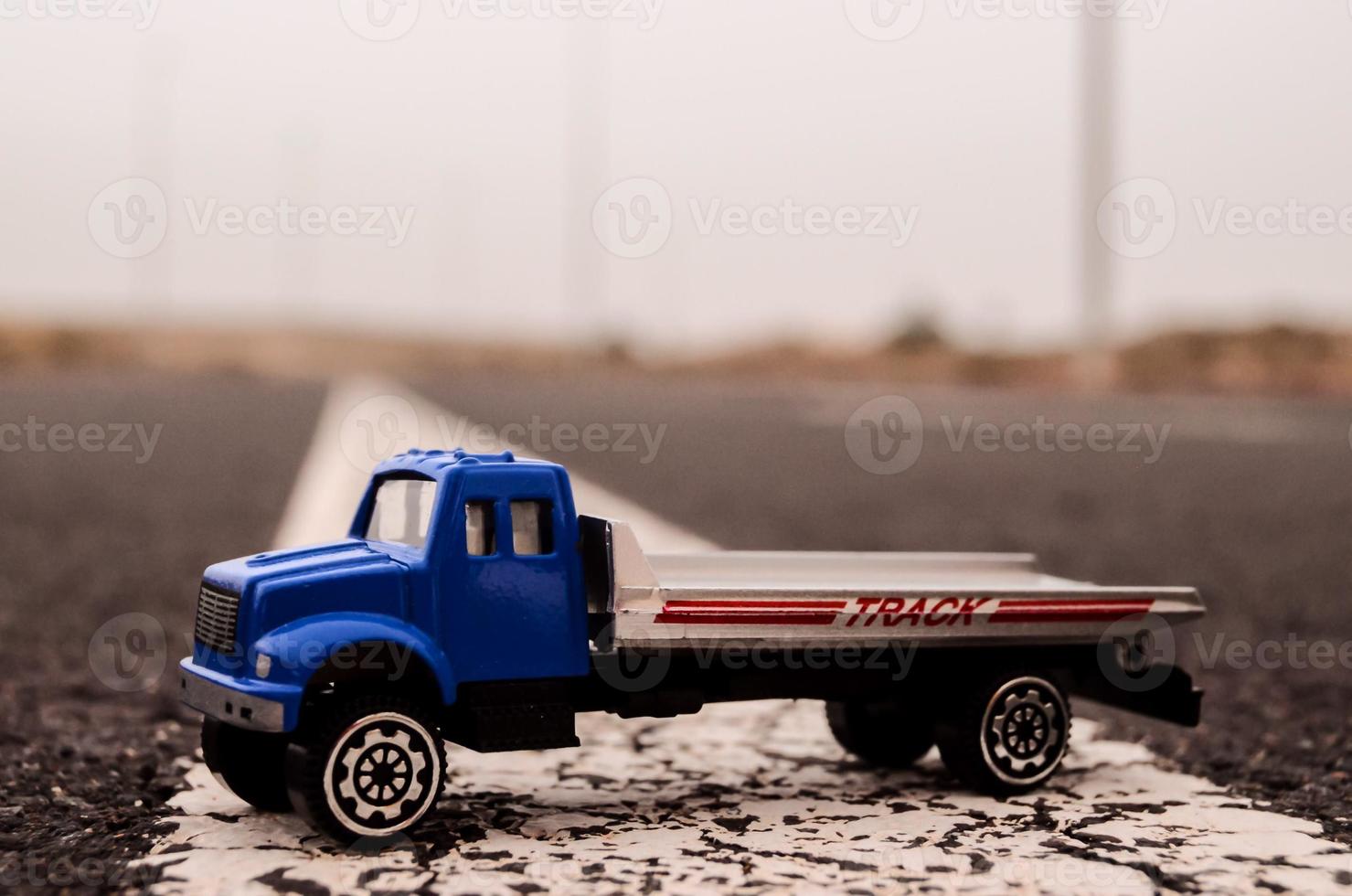 Toy truck on the road photo