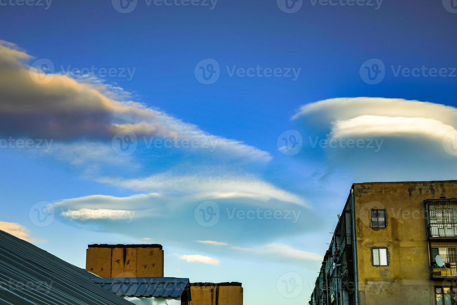 Lenticular clouds are rather rare natural phenomenon. Such clouds are formed on the crests of air waves or between two layers of air. photo