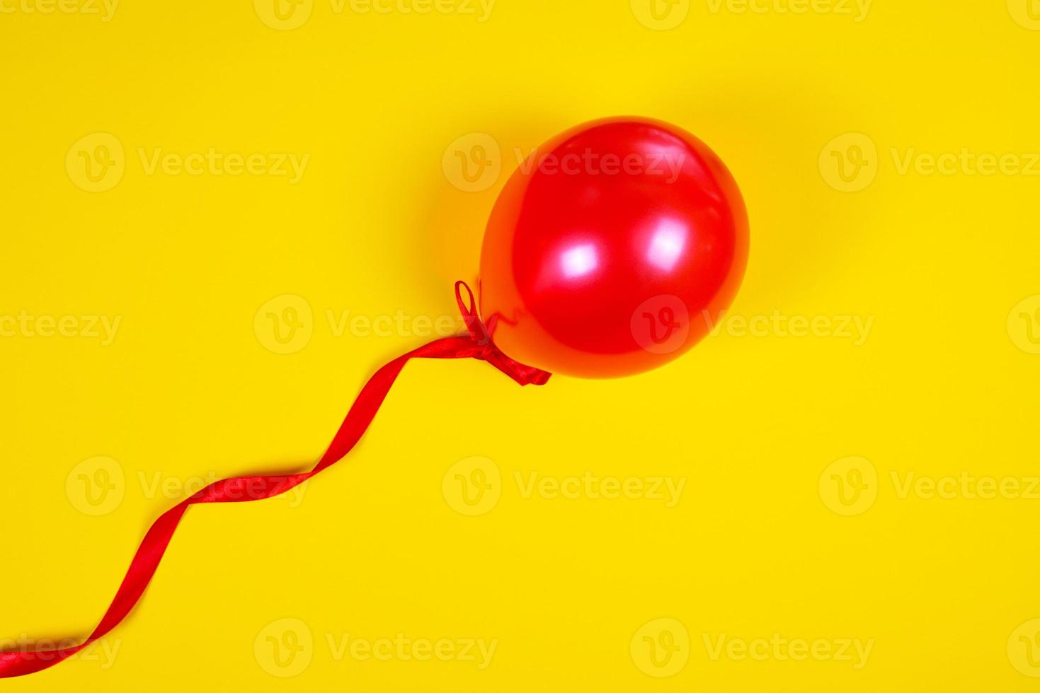 Red balloon on a red ribbon photo