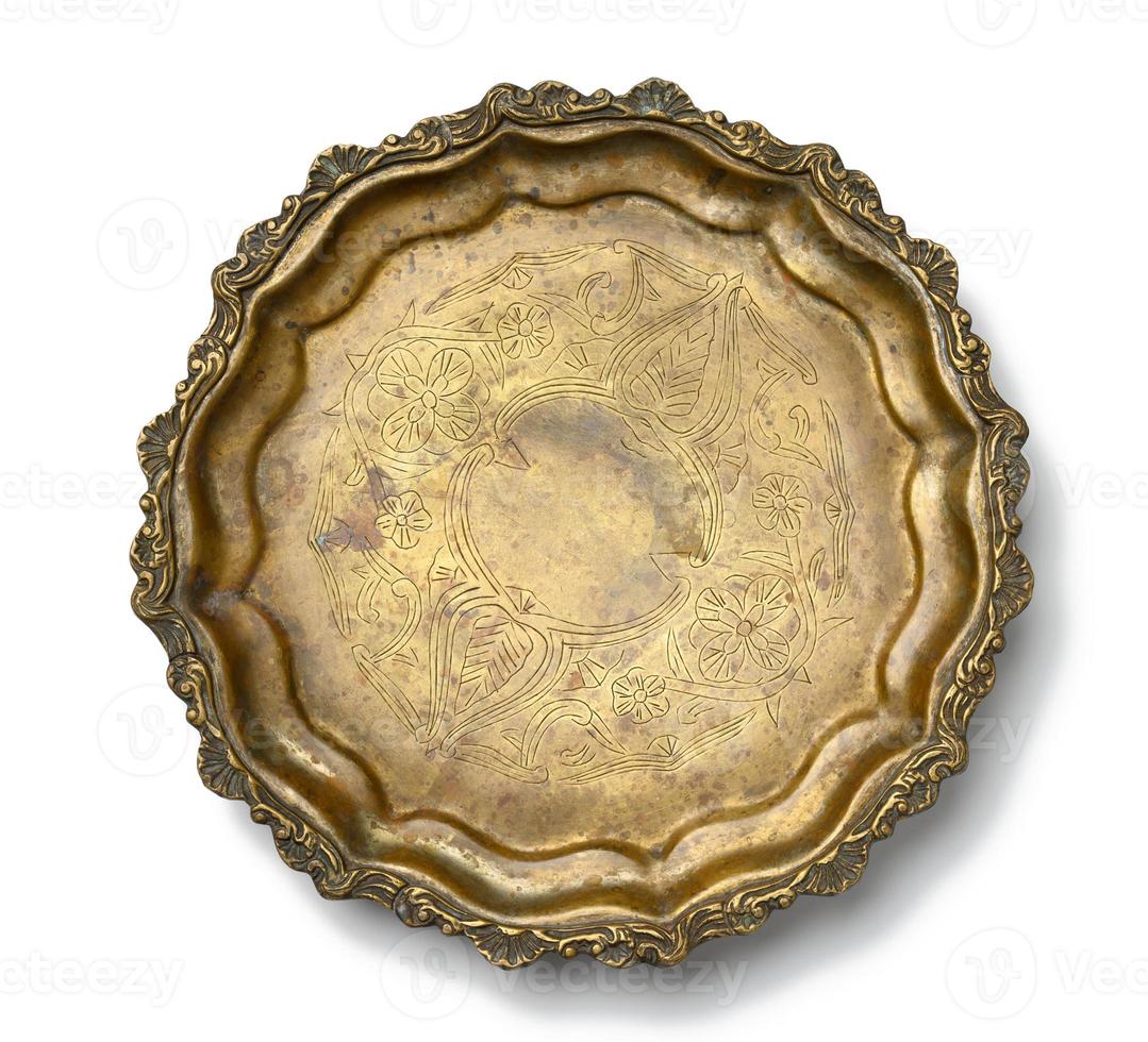 empty copper round vintage plate isolated on white background, fruit dish. photo