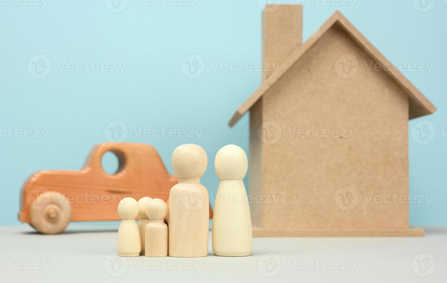 wooden house and car with miniature family figures, mortgage and loan concept photo