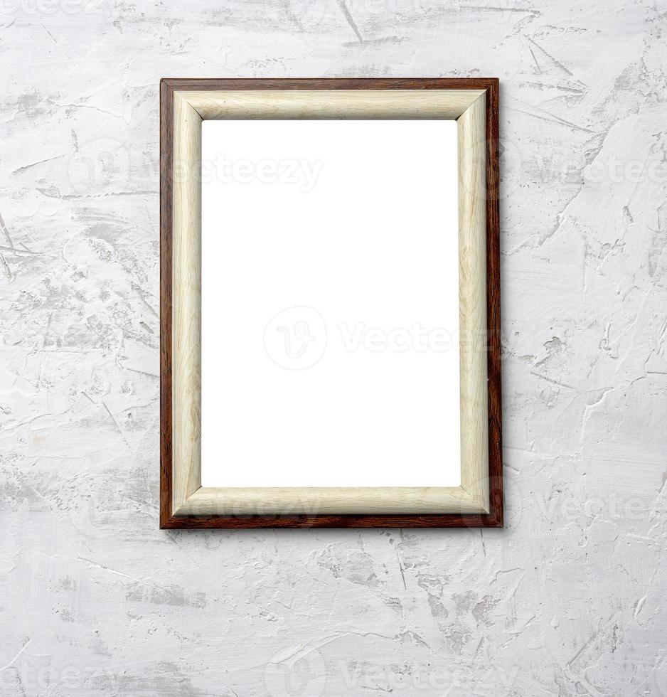 wooden frame hanging on white cement wall photo