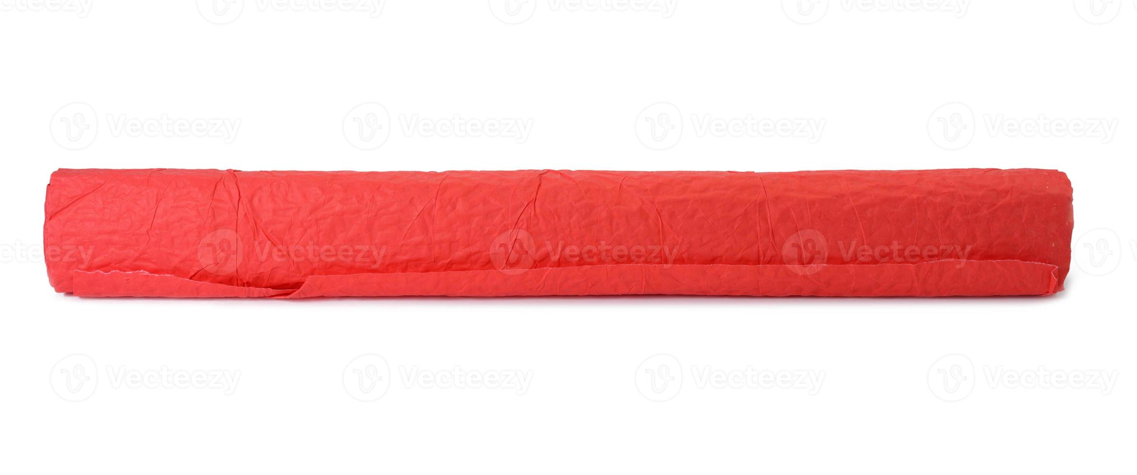 roll of red crumpled paper for gift wrapping isolated on white background photo