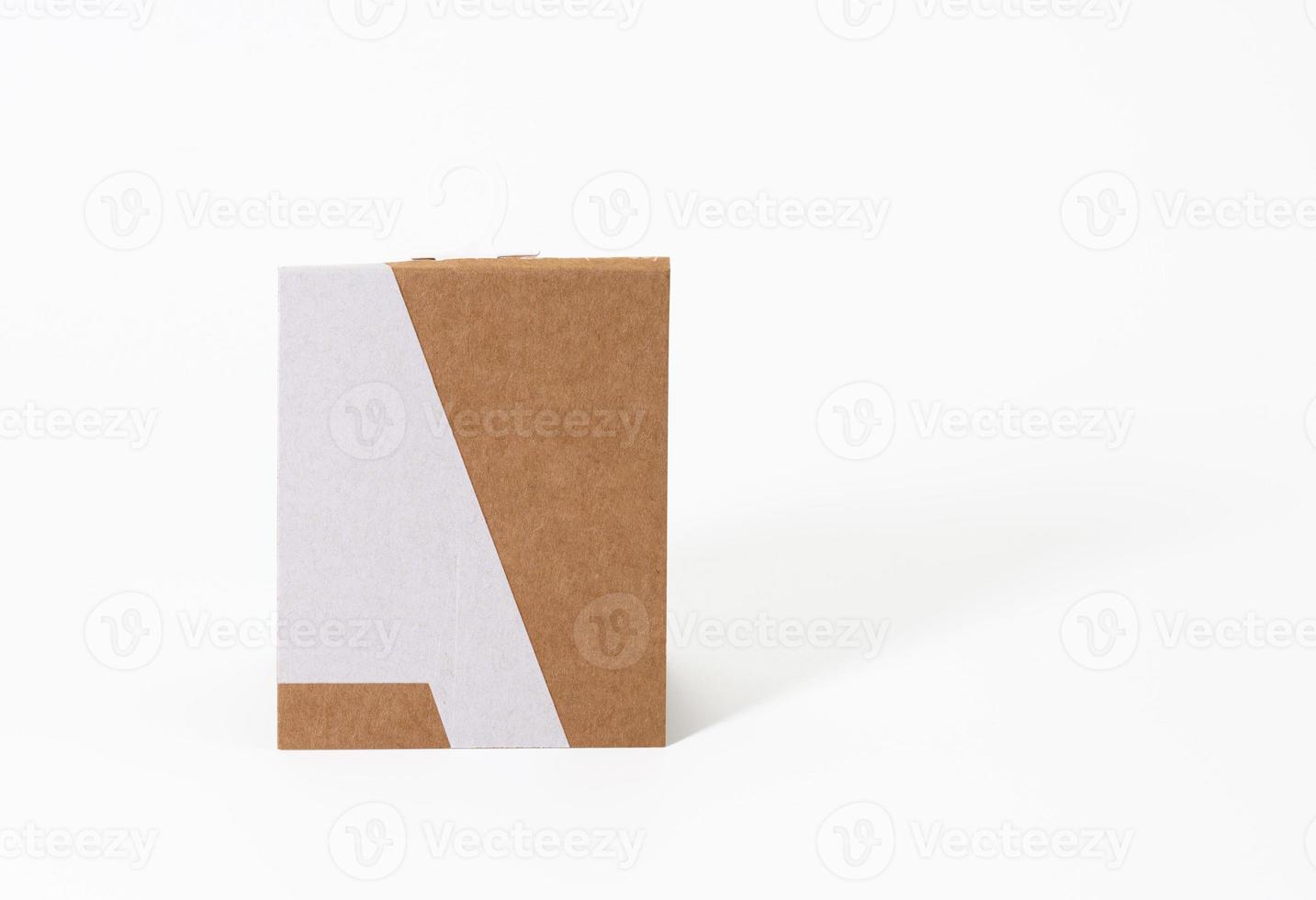 rectangular brown paper tag with sock hook on white background photo