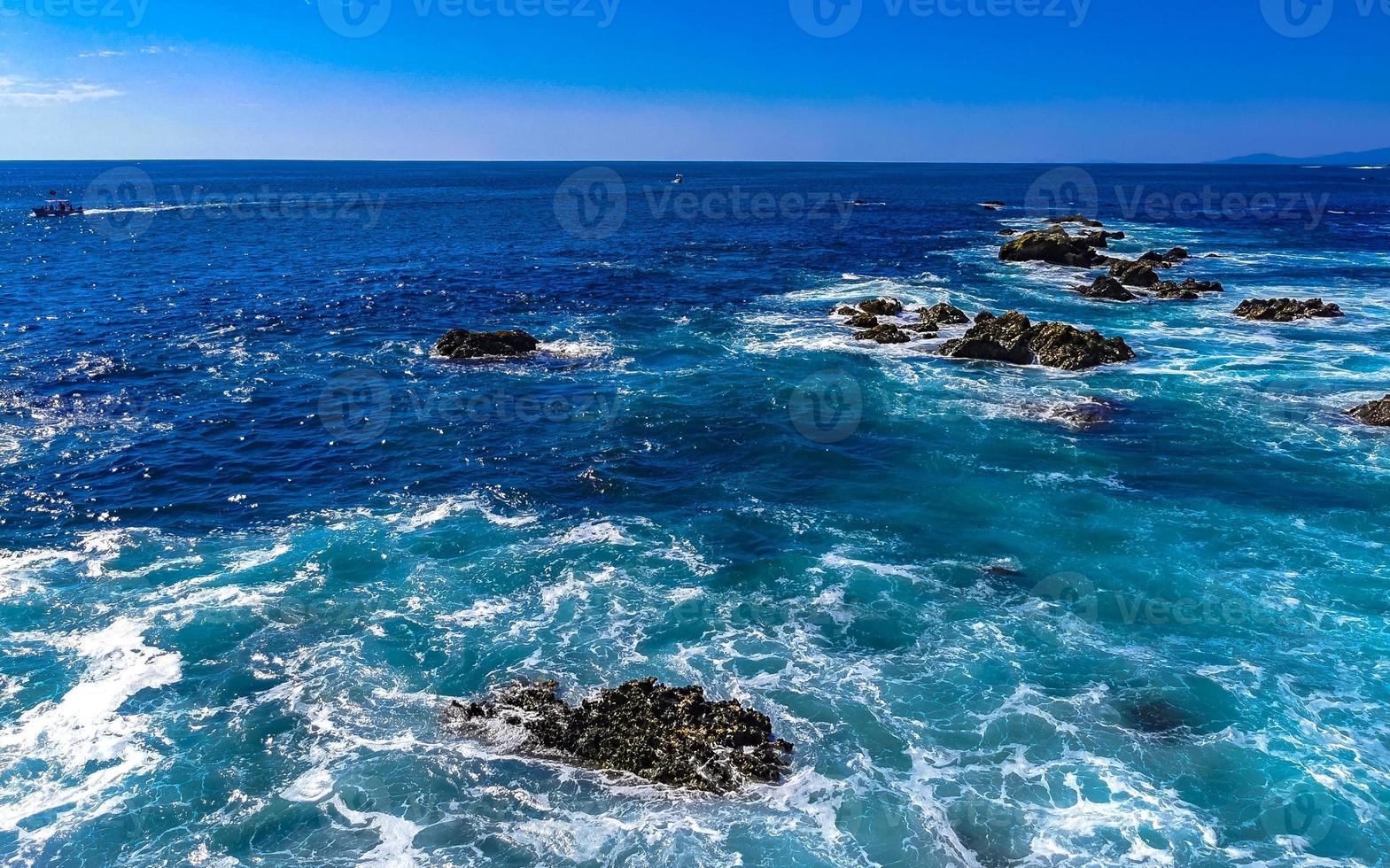 Beautiful rocks cliffs view waves at beach Puerto Escondido Mexico. photo